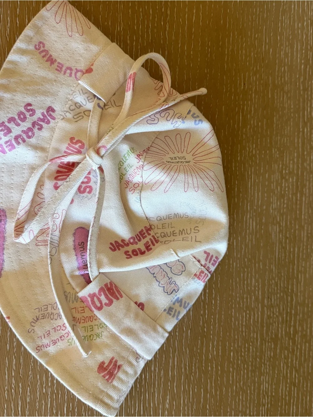 Jacquemus Cream Bucket Hat with Multicolor Logo Print - size 60